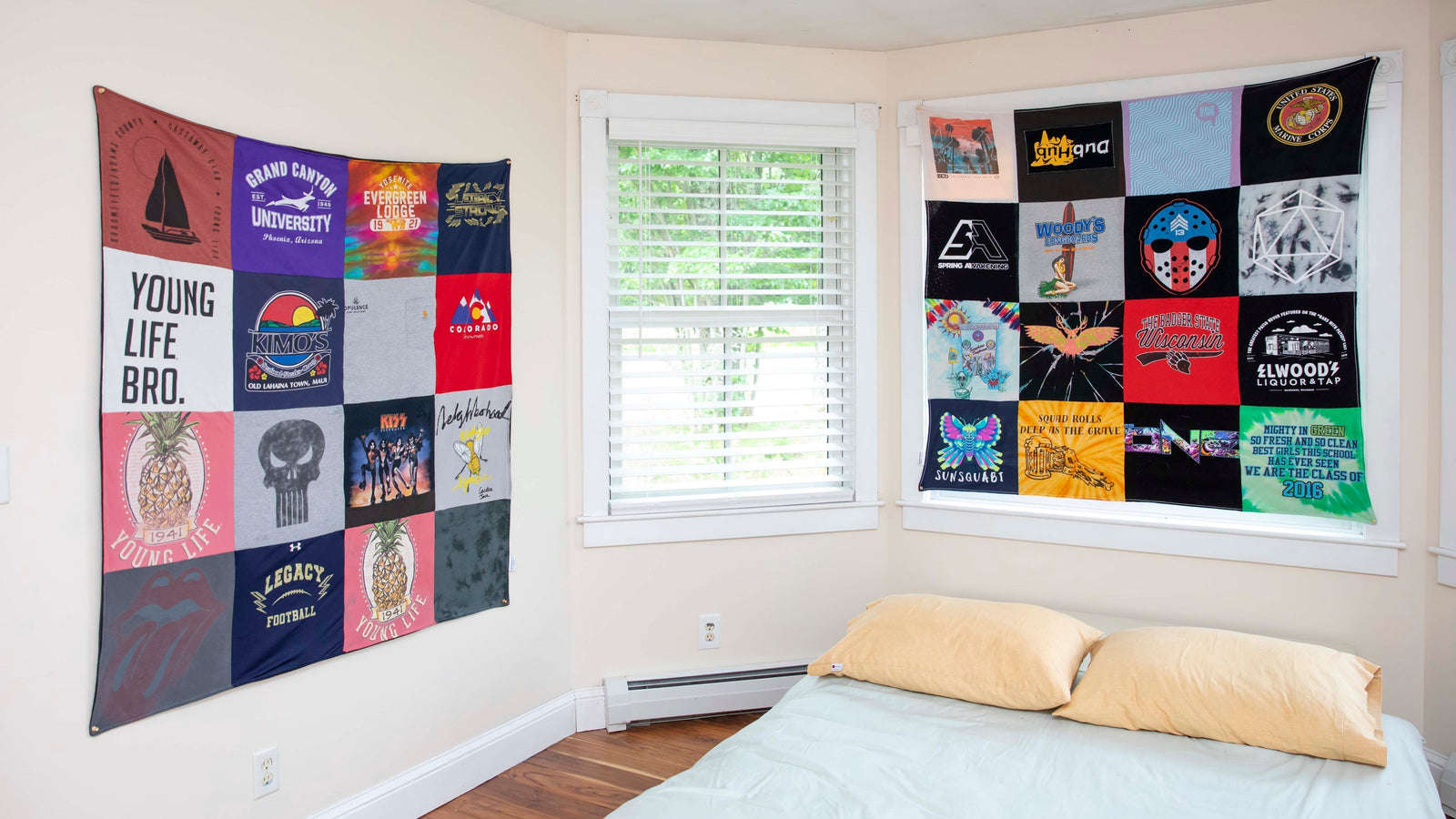 Two t-shirt blankets hanging on bedroom walls.